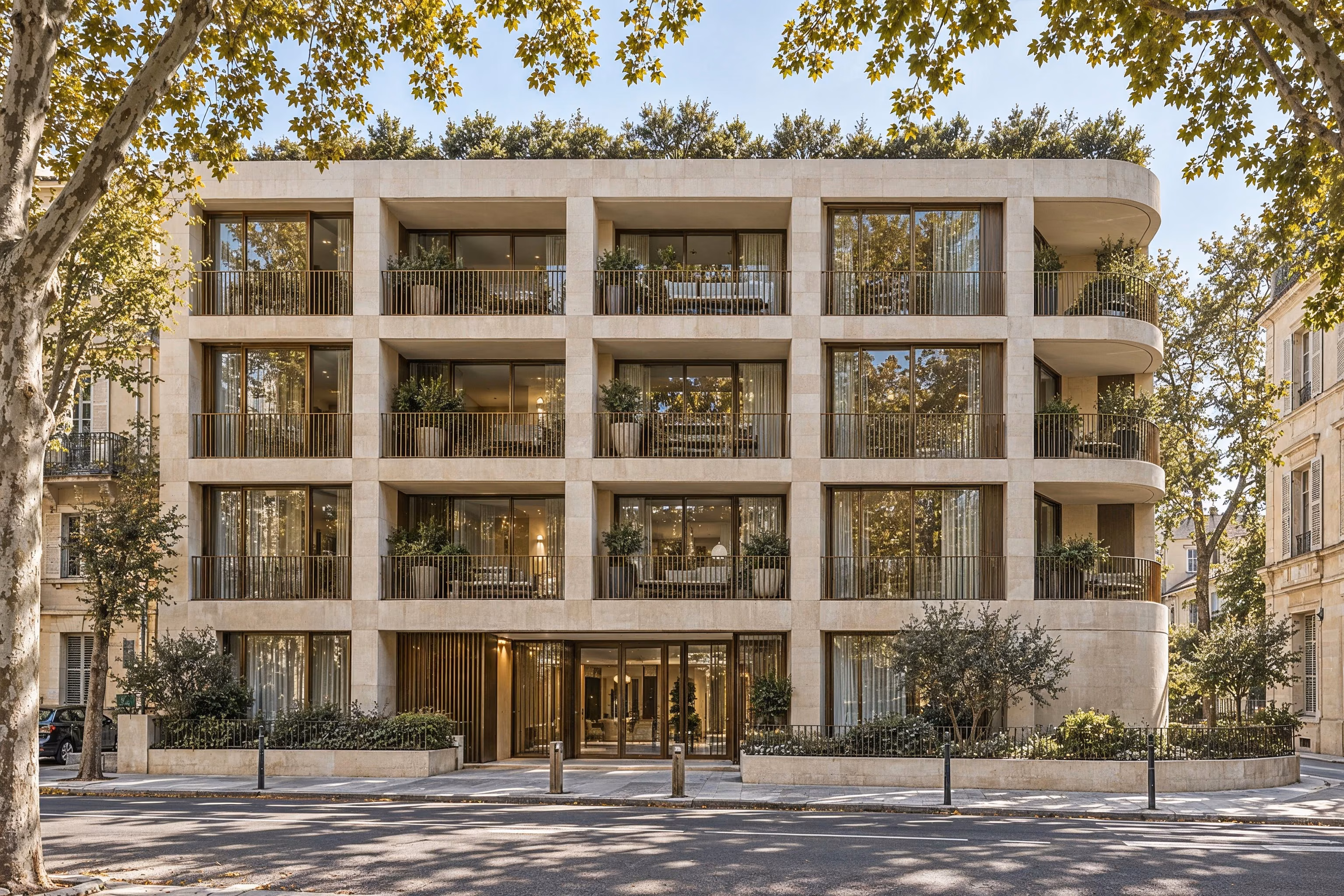 Résidence Sillage — Street elevation with recessed bronze-framed loggias and a sheltered entrance.